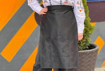 Black apron with embroidery from the "Tisto" project